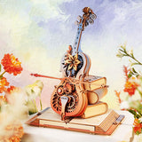 ROKR mechanische Spieluhr mit Cello auf mystischem Buch in Blau, Rot und Orange