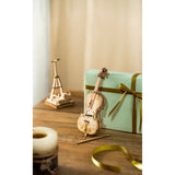 Rolife Cello TG411 Rückseite mit gravierten Schriftrollen