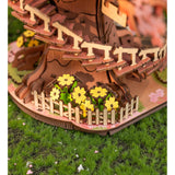 Rolife Baumhaus Bausatz mit Kirschblüten als Dekoration im Regal