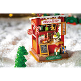 Miniaturhaus Bausatz Cocoa Shop – Geschenke mit Schleifen vor der Weihnachtsbude