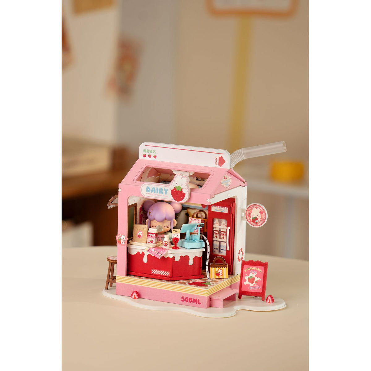Miniaturhaus Milchladen DS034 mit leuchtend roten Verzierungen und LED-Licht
