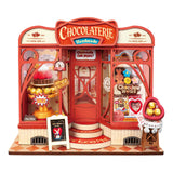 Schokoladenladen Bausatz mit Schaufenster, Schokoladenkuchen und Himbeeren