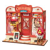 Miniaturhaus Bausatz aus Holz Sweet Chocolate Shop mit runden Stufen am Eingang