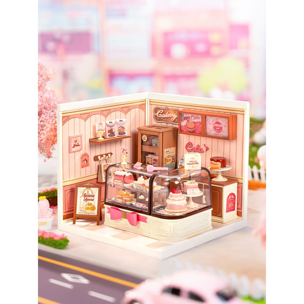 Rolife Tasty Cake Shop Miniaturhaus: geschwungene Thekenvitrine mit knallrosa Schleife