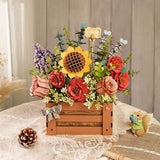 Wooden Bloom Box von Rowood mit roten Kamelien, rosa Rosen und grünen Zweigen
