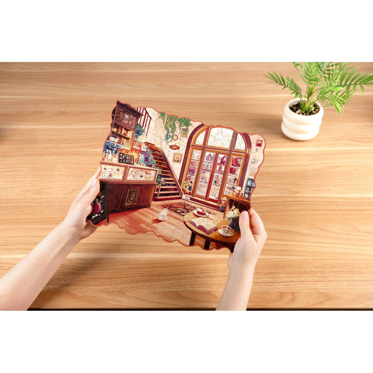 Rowood Cozy Winter Café Puzzle – Rundbogenfenster und Holztheke im Detail